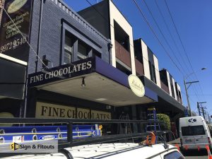 Building signs, panel sign