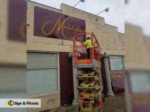 Building sign, sign installation, panel sign