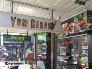 under awning sign, light box sign, shop signage