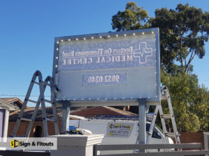 illuminated sign, pylon sign, sign installation