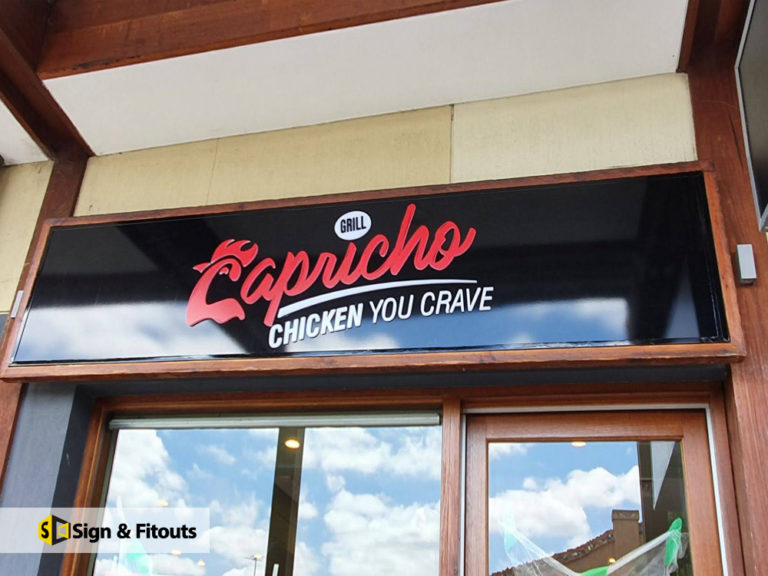 Capricho Grill 'Chicken You Crave' sign on black panel above a shopfront in Balwyn North