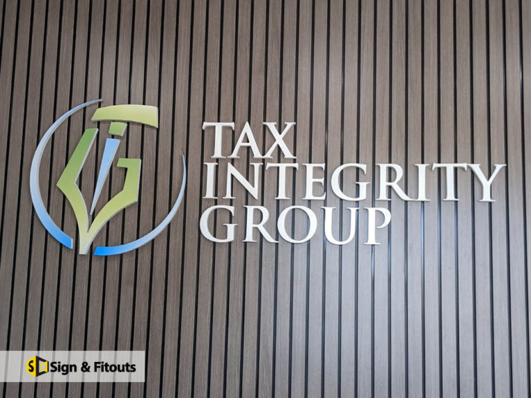 Tax Integrity Group 3D logo and lettering on a timber batten reception wall in Preston