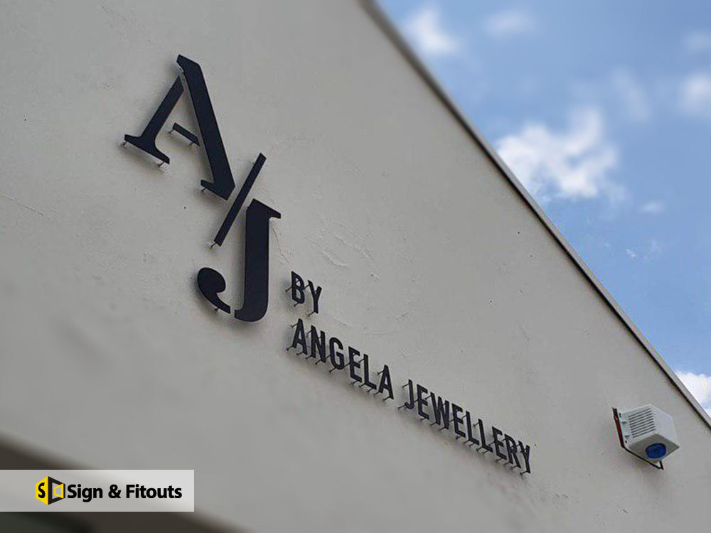 Black 3D stand-off letters for A/J by Angela Jewellery on a building wall, South Yarra
