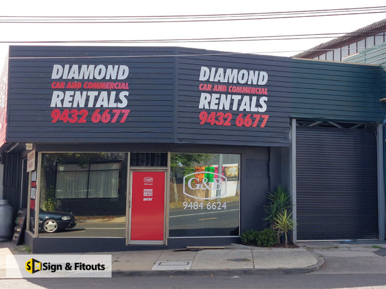 Diamond Car and Commercial Rentals fascia signs with phone number on a dark building in Preston
