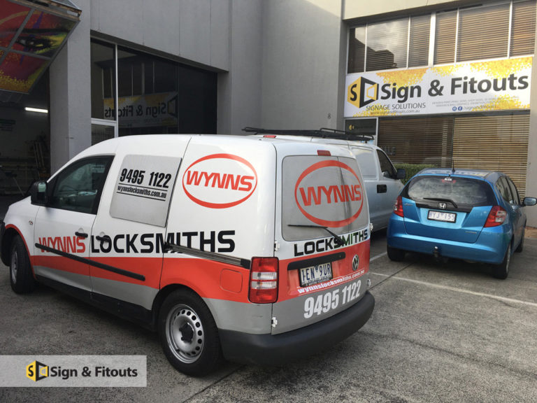 White Wynns Locksmiths van with red and black vehicle graphics