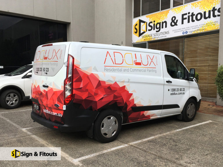 White Addlux van with a red geometric part wrap and company lettering