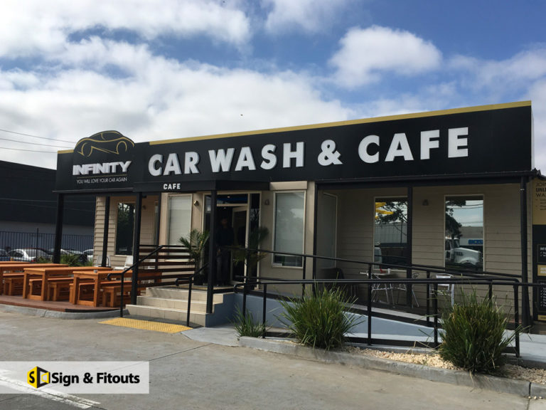 Infinity Car Wash & Cafe fascia sign above a cafe deck in Preston