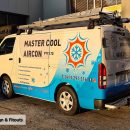 Master Cool Aircon van with a blue and white vehicle wrap