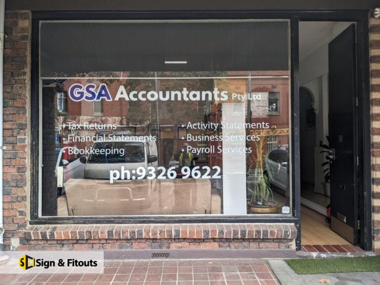 Window graphics for GSA Accountants in North Melbourne: white and blue vinyl lettering with services and phone number, fitted inside the glass